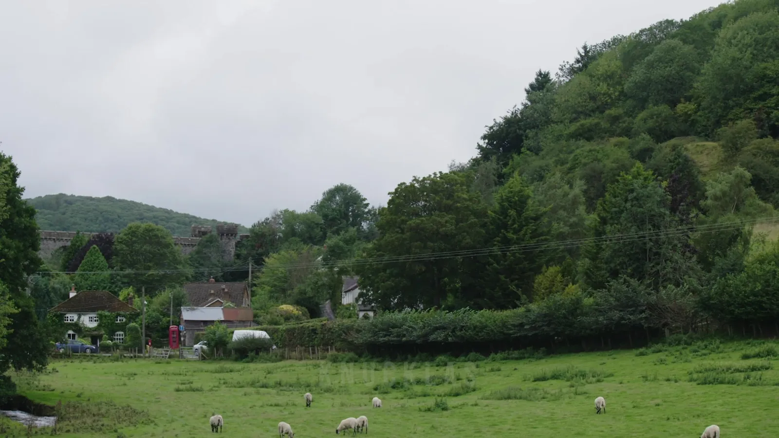 Knucklas from the fields, with the viaduct behind the village: a still from the film Made in Knucklas